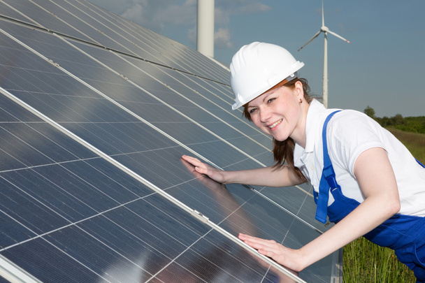Engineer or installer inspecting solar energy panels - Photo, Image