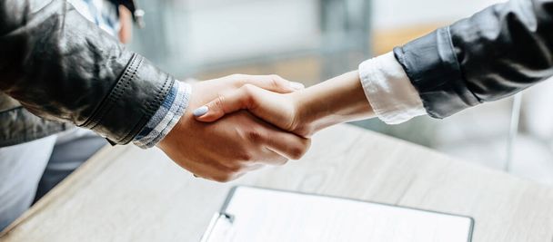 Man and woman hand shaking. Handshake after good cooperation, Businesswoman Shaking hands with Professional businessman after discussing good deal of contract. Business concept. - Fotó, kép