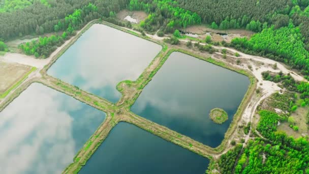 Aerial View Retention Basins, Wet Pond, Detention Basin Or Stormwater Management Pond, Is Artificial Pond With Vegetation Around The Perimeter, And Includes A Permanent Pool Of Water In Its Design 4K - Footage, Video