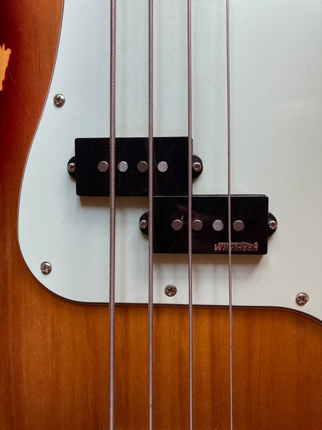 Bass guitar corpus with 2 pickups and 4 strings. - Photo, Image
