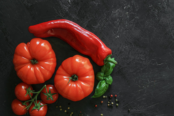 Fresh Coeur de boeuf tomato on a dark background - Photo, Image