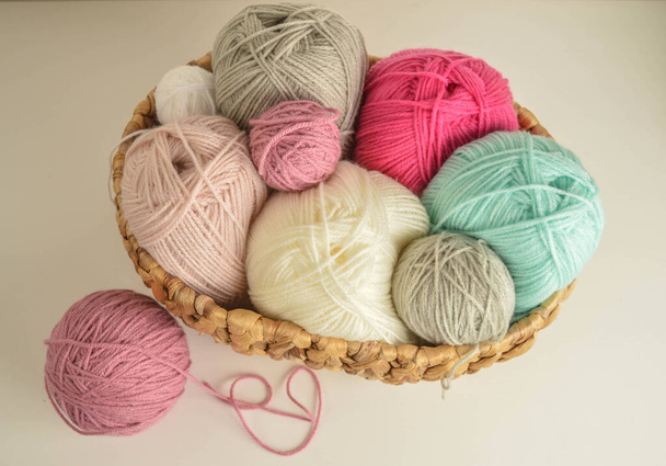 woolen balls with crochet hooks in basket for handicrafts - Valokuva, kuva