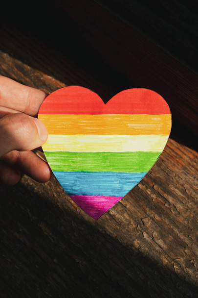the rainbow hand-made heart in the hand. The concept of the LGBTQ+ Pride celebration - Photo, Image