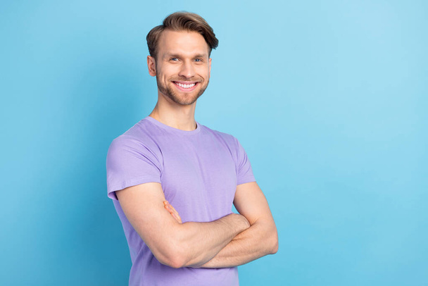 Profile photo of half turned satisfied person crossed arms toothy smile isolated on blue color background - Photo, Image