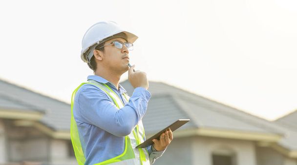 engineer working on digital tablet at construction site - Photo, Image
