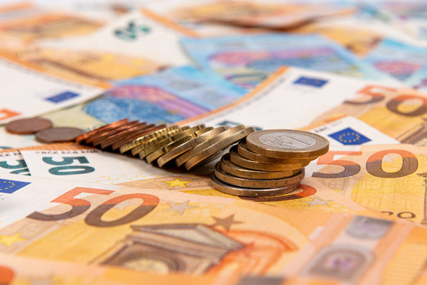 coins on the background of euro banknotes, Euro bill as part of the economic and trading system, Close-up - Foto, Bild