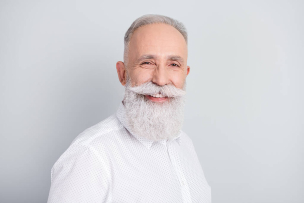 Photo of happy positive cheerful old man smile nice good mood wear white shirt isolated on grey color background - Foto, immagini
