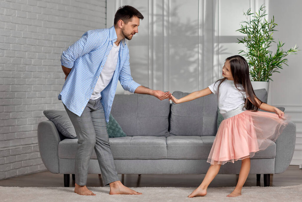 father dancing with his little cute daughter at home - Fotoğraf, Görsel