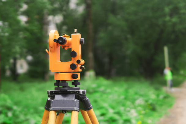 modern theodolite at work close up on blurred background outdoors - Photo, Image