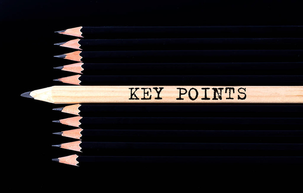 Business concept. White pencils with text KEY POINTS on black background - 写真・画像