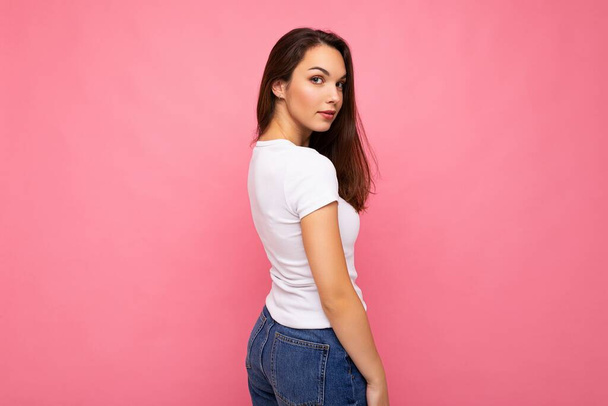 Side-profile photo shot of cute nice charming gorgeous attractive pretty youngster happy woman wearing white t-shirt for mockup isolated over colorful background with copy space - Photo, Image