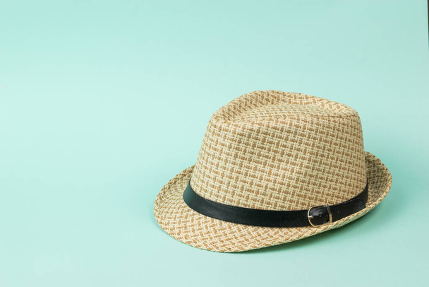 Stylish summer men's hat with a strap on a blue background. Classic men's headdress. - Fotoğraf, Görsel