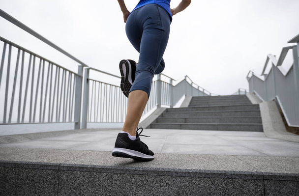 woman running on a stairs in the city - Φωτογραφία, εικόνα
