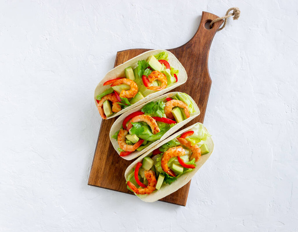Tacos with shrimp, avocado and salad. Mexican food - Fotografie, Obrázek