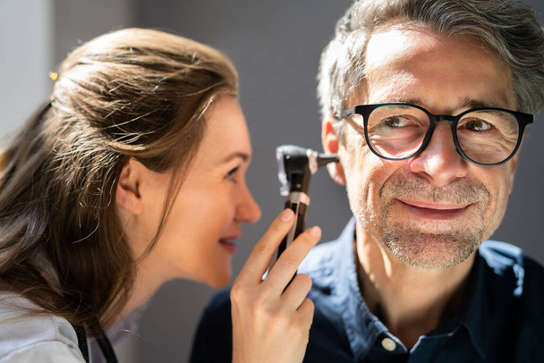 Otolaryngology Ear Check Using Otoscope. Doctor Examining Patient - Foto, Bild