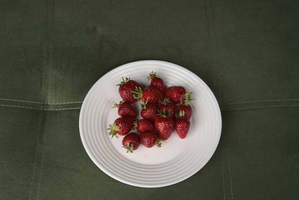 Strawberries on a white plate. - Photo, Image