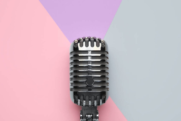 Retro microphone on color background, closeup - 写真・画像