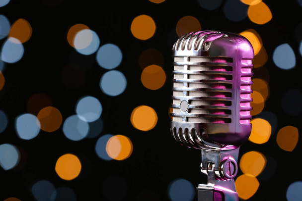 Retro microphone against defocused lights, closeup - Photo, Image
