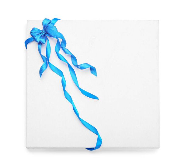 Blank card with blue ribbon on white background - Photo, Image