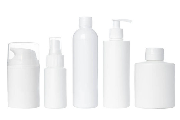 empty white plastic bottles for cosmetics, cream, lotion, serum, medication on white background. Isolated - Photo, Image