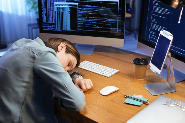 Female programmer sleeping in office at night - Photo, Image