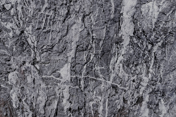 A greyscale shot of the textures and patterns of a rough surfac - Fotó, kép