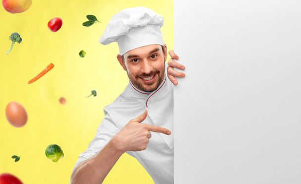 happy smiling male chef with big white board - 写真・画像