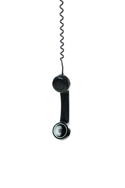 Telefone vintage pendurado em um fundo branco.  - Foto, Imagem