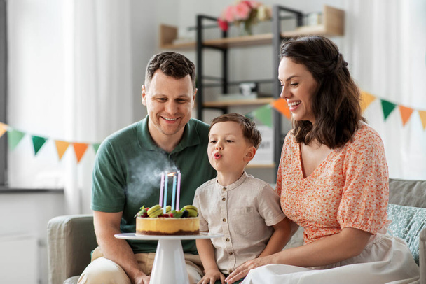 happy family with birthday cake at home - Φωτογραφία, εικόνα