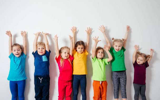Group of preschool kids posing together, friendship concept - Фото, изображение
