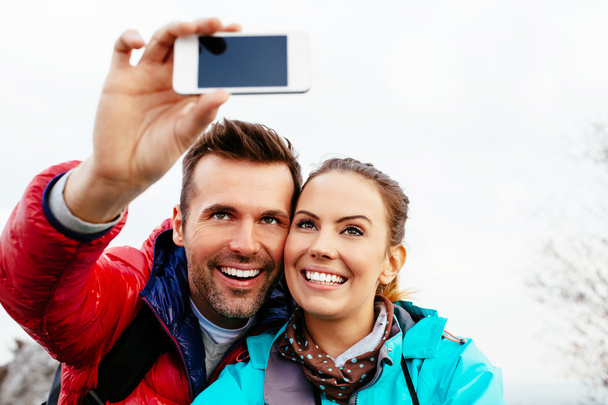Couple taking selfie during hike - Fotó, kép