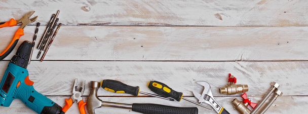 top view of set of hand tools on wooden background with copy space, suitable for header or banner - Фото, изображение