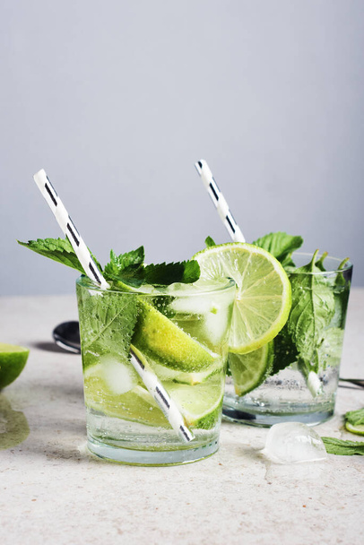 Refreshing drink with lime, mint and ice, mojito cocktail. - Photo, Image