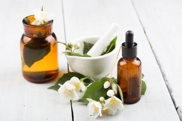Spa concept - making essential oil with jasmine flowers - Zdjęcie, obraz