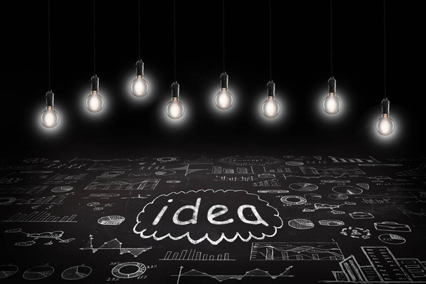Business concept - word 'Idea ', sketch with schemes and graphs on chalkboard - Zdjęcie, obraz
