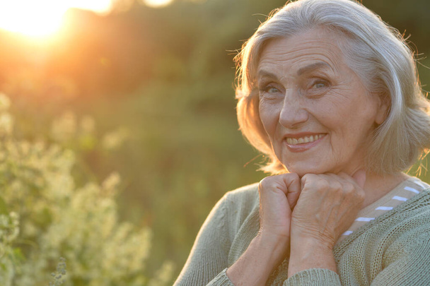  happy smiling senior woman outdoors  - Foto, Bild