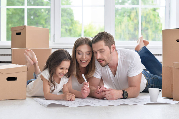 Young happy family moving into their new home - Photo, image