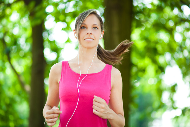 Woman jogging outdoor - Фото, изображение