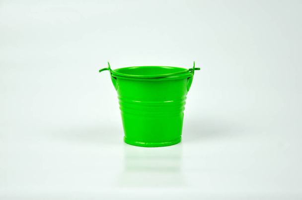 Small green pail isolated on white background - Photo, Image