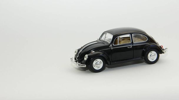black toy car on a white background - Zdjęcie, obraz