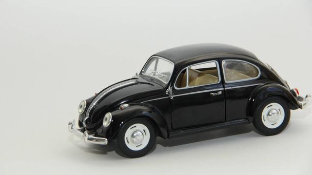 black toy car on a white background - Zdjęcie, obraz