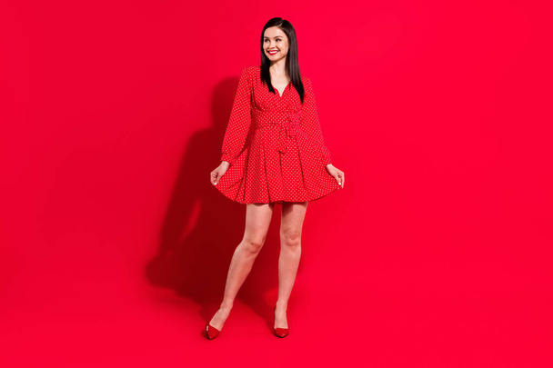 Full size photo of sweet brunette lady stand look empty space wear red dress shoes isolated on vivid color background - Fotografie, Obrázek