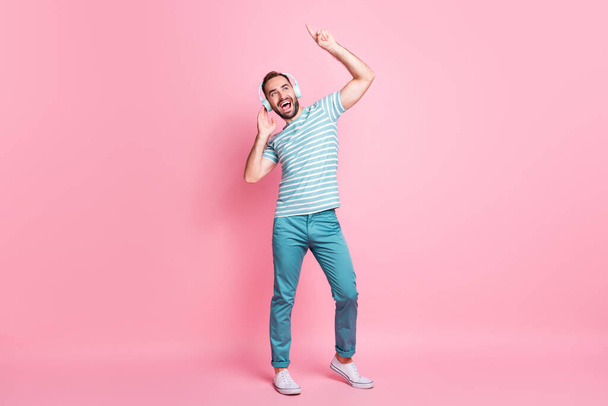 Full length body size view of nice cheerful glad guy enjoying listening modern melody having fun isolated over pink color background - Φωτογραφία, εικόνα