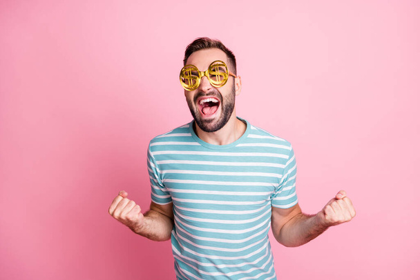 Close-up portrait of nice overjoyed satisfied cheerful guy wearing dollar specs having fun isolated over pink pastel color background - Фото, изображение