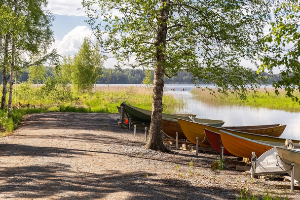 Boats on the shore of the lake. Fishing. Summer landscape. Summer background. Camping. Rest in your own country. High quality photo - Photo, Image