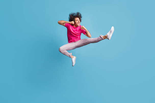 Full length body size view of nice cheerful overjoyed guy jumping dancing contemporary ballet isolated over bright blue color background - Фото, зображення