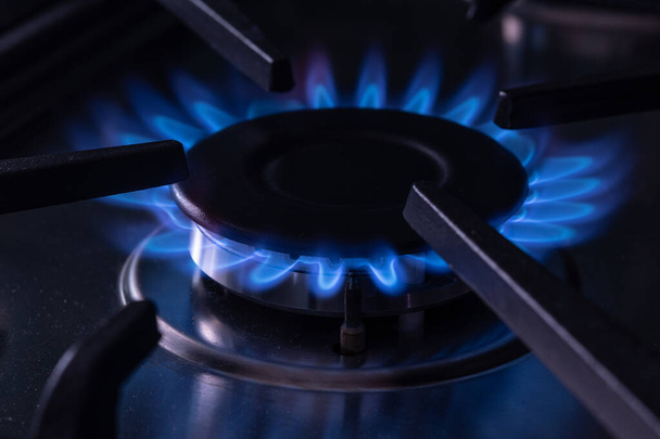 Stove lit with bluish natural gas fire kitchen - Photo, Image
