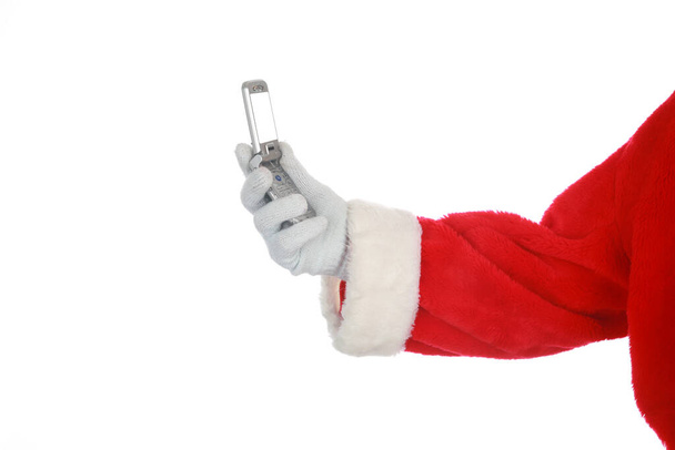 Santa Claus.  Santa Claus Isolated on white. Room for text. Santa Claus poses for his Christmas Portrait against a white wall. Clipping path. Santa says HO HO HO. Merry Christmas. Happy New Year to all. Saint Nick uses his Cell Phone. - Foto, imagen