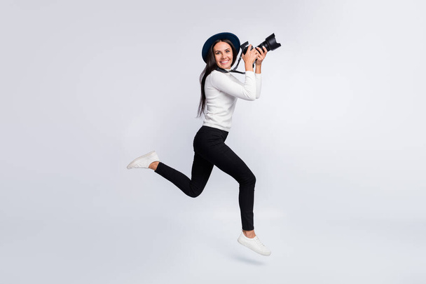 Full body profile side photo of young brunette jump up run hold camera job photographer isolated on grey color background - Fotoğraf, Görsel