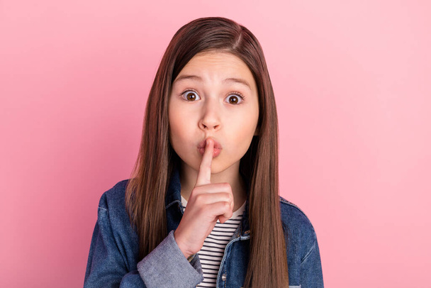 Photo portrait of small girl put finger near lips keeping secret isolated on pastel pink color background - Photo, Image